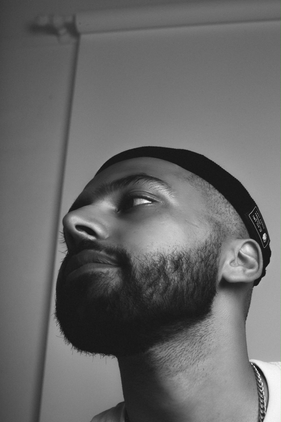 Abdul, the content creator behind Aksoheart, in a black and white portrait